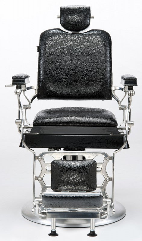 La poltrona da barbiere JOSEPHINE della MUSTER è in Vintage Style con schienale reclinabile e Il suo rivestimento in ecopelle.